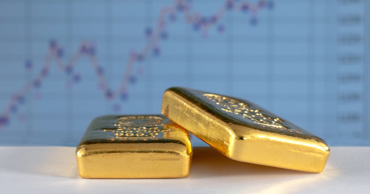 gold_bars_with_trading_background.jpg